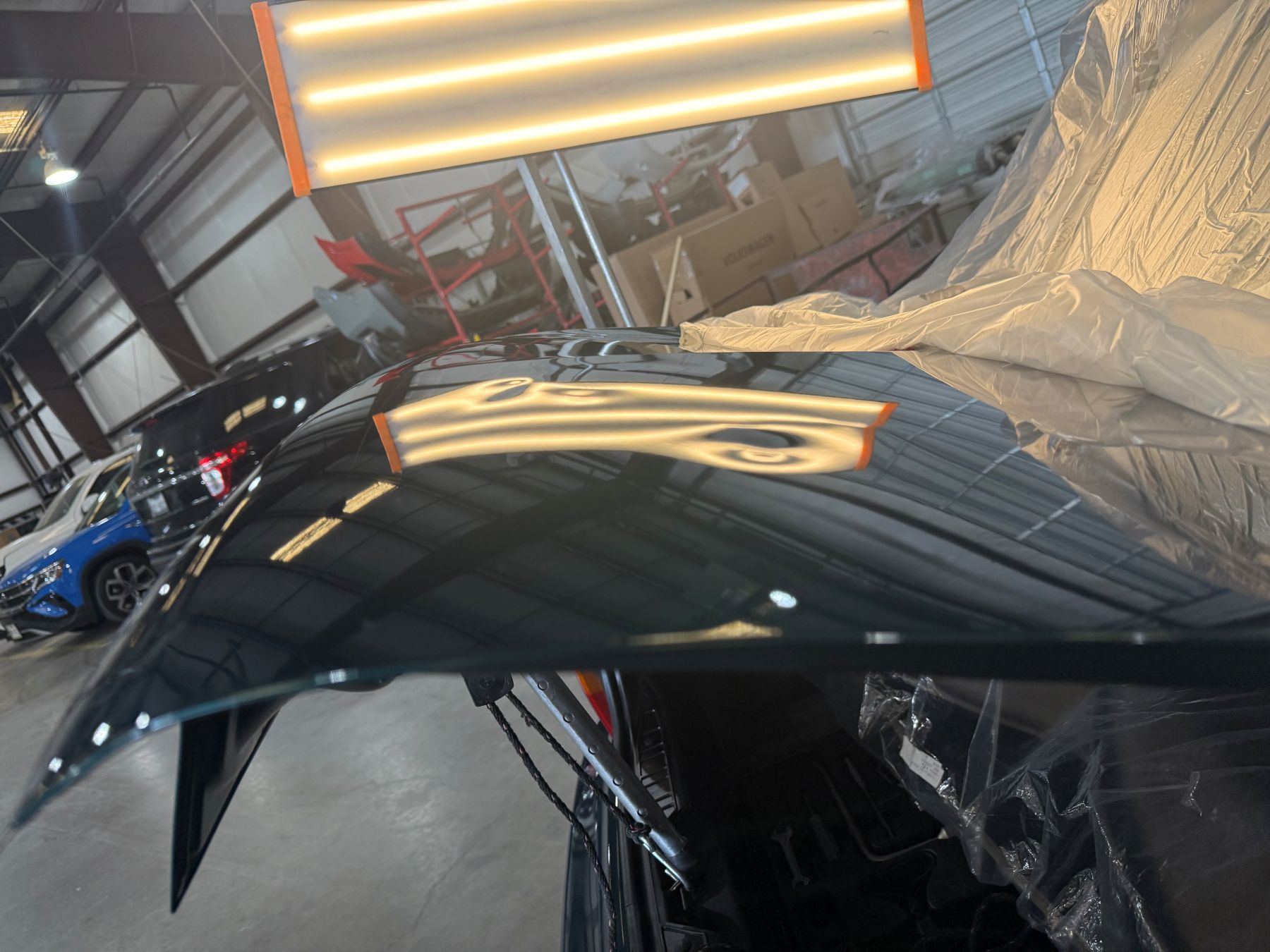 Before: Dent along paint line restored to seamless factory finish