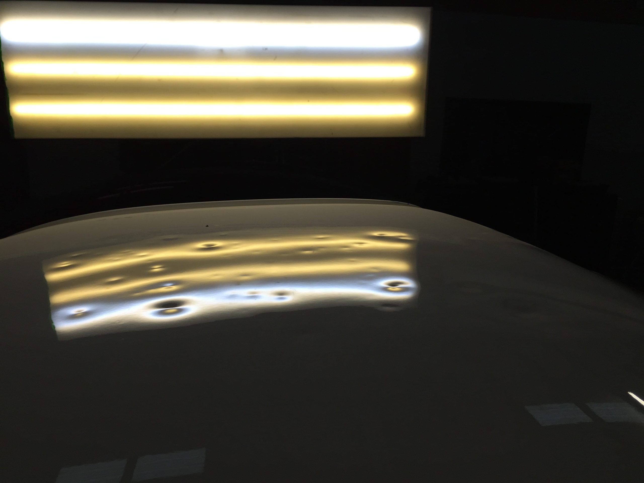 Before: Body line crease carefully worked back to original shape