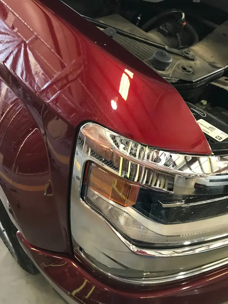 After: Hood dent smoothed and restored without paint or filler