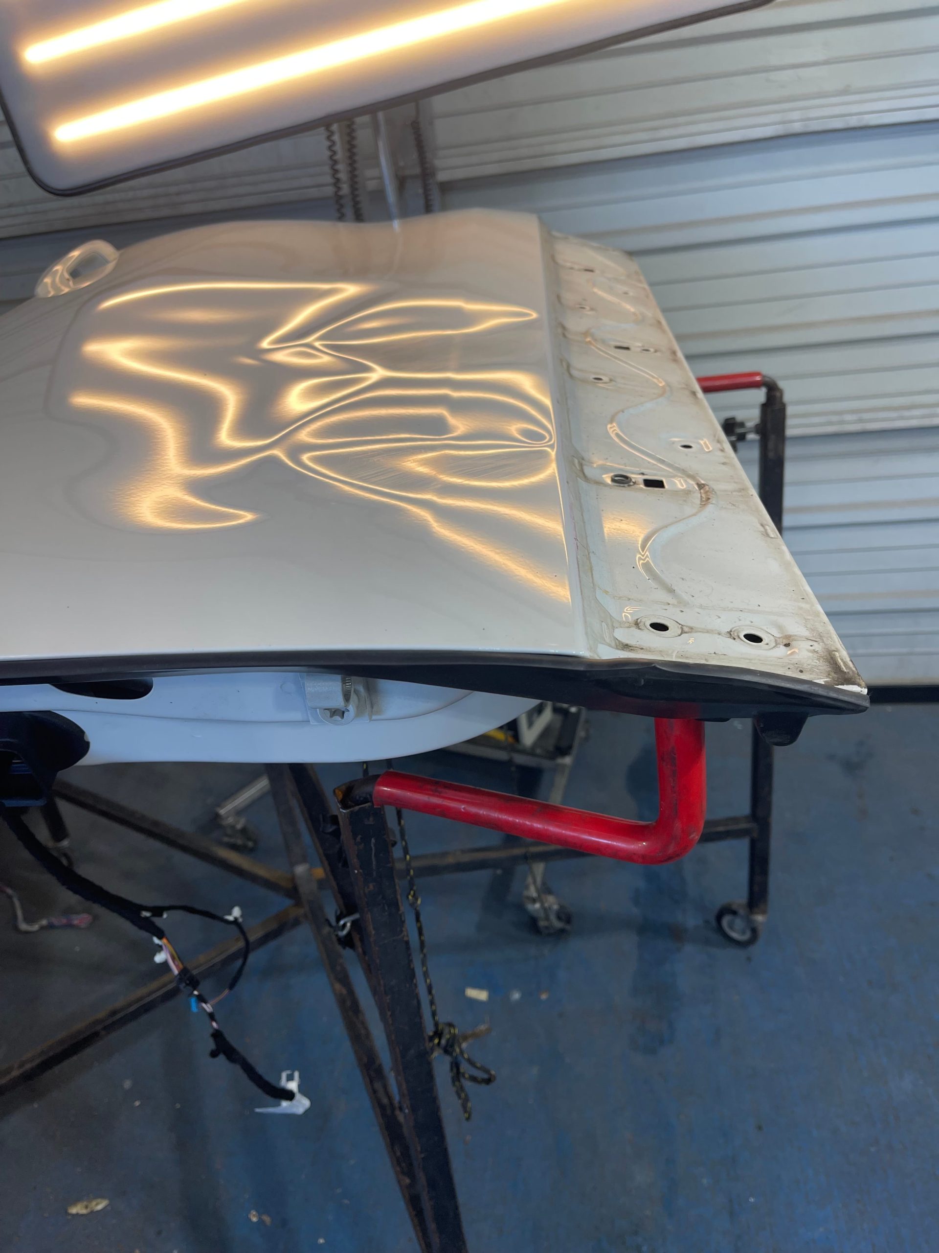 Close-up of expert dent repair in progress